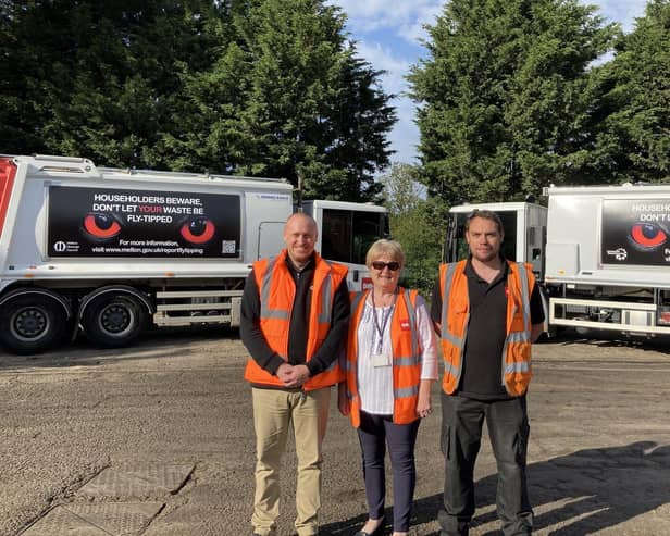 Deputy Melton Borough Council leader, Margaret Glancy, with members of the local bin collection team and lorries with the new signage on