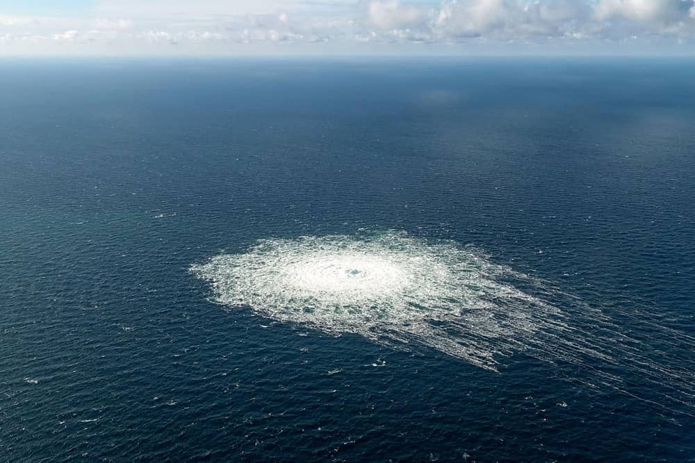 This handout picture released on September 27, 2022 by the Danish Defence Command shows the gas leak at the Nord Stream 2 gas pipeline as it is seen from the Danish Defence's F-16 rejection response off the Danish Baltic island of Bornholm, south of Dueodde. - The two Nord Stream gas pipelines linking Russia and Europe have been hit by unexplained leaks.