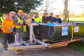 Melton and Oakham Waterways Society volunteers on their new workboat