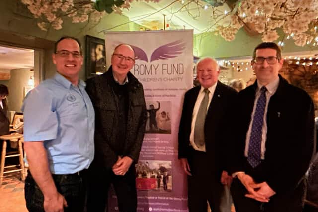 From left, David Bates, owner of The Wheel Inn, cricket commentator Jonathan Agnew, and Romy Fund trustees Gordon Wells and Michael Cooke