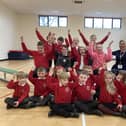 Waltham CE Primary School pupils celebrate their new sports hall with head teacher Hollie Geeson