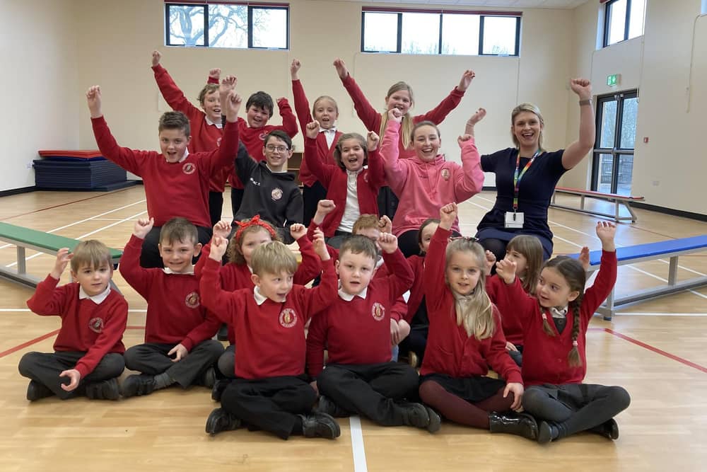 Waltham CE Primary School pupils celebrate their new sports hall with head teacher Hollie Geeson
