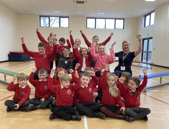 Waltham CE Primary School pupils celebrate their new sports hall with head teacher Hollie Geeson