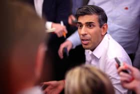 Prime Minister Rishi Sunak holds a "huddle" press conference with political journalists on board a Government plane as he heads to Bali, in Indonesia to attend the G20 summit. Picture date: Sunday November 13, 2022.