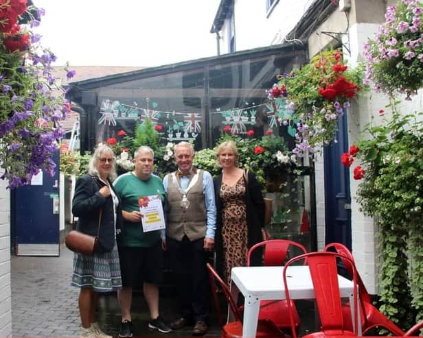 Melton's Hidden Gem competition winners back in 2022, the Half Moon, receive their award
