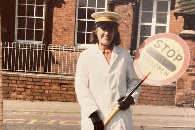 Vera Foster pictured during her earlier years as Asfordby Hill Primary School's lollipop lady