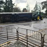 The overturned agricultural trailer on Lady Wilton Bridge in Melton this morning IMAGE John Southerington