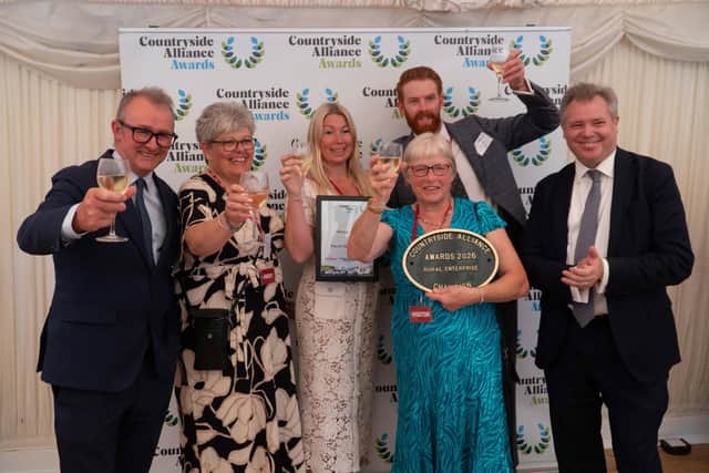 The team from March House Farm celebrate their national Rural Enterprise award with Edward Argar MP (right)