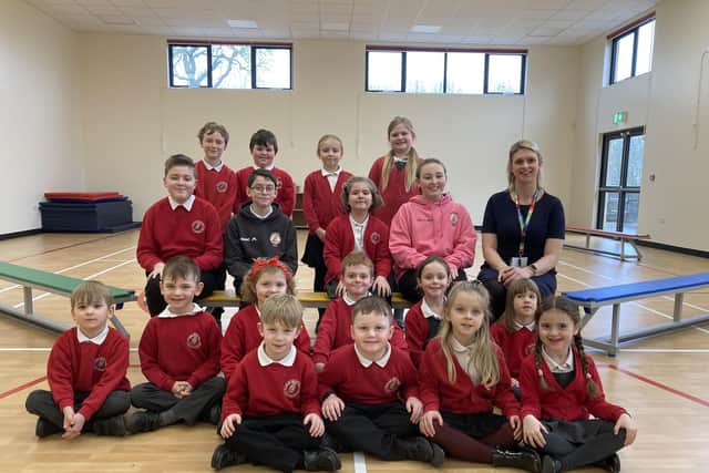 Waltham CE Primary School pupils with head teacher Hollie Geeson in their new sports hall