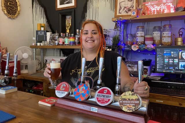 Charlie Donovan serving at Charlie's Bar at Melton Mowbray