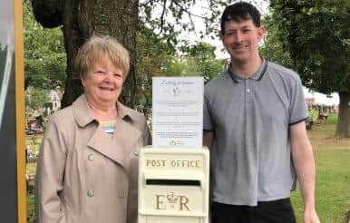 Councillor Margaret Glancy with fellow Melton Newport representative, Councillor Simon Lumley, with the new memorial post box provided by Melton Borough Council at the Thorpe Road cemetery