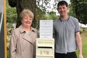 Councillor Margaret Glancy with fellow Melton Newport representative, Councillor Simon Lumley, with the new memorial post box provided by Melton Borough Council at the Thorpe Road cemetery