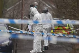 Forensic officers from Police Service of Northern Ireland (PSNI) at the sports complex in the Killyclogher Road area of Omagh