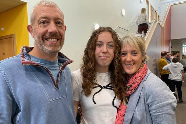 Lucy Donaghey with parents Karl and Rachel on GCSE results day at John Ferneley College