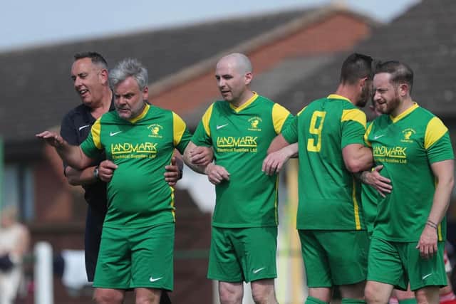 Stephen King refereeing a match