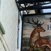 The new pub sign af Burrough's refurbished The Stag & Hounds
