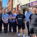 Some of Melton Mowbray's traders who have built a community with their radios to make the town centre safer