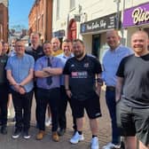 Some of Melton Mowbray's traders who have built a community with their radios to make the town centre safer