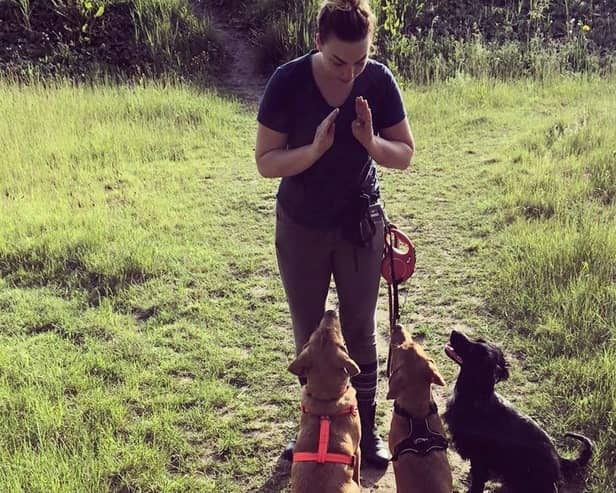 Louise Haslam training dogs at the family business at Eaton