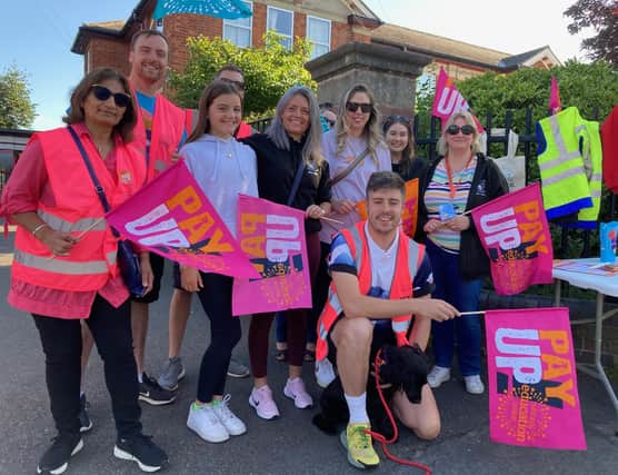 George Rhodes (front) with fellow Brownlow School staff members on the picket line on Limes Avenue this morning
