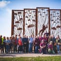 Families of Melton's wartime paratroopers pictured last month at the Arnhem sculpture on Ginkel Heath last month where 156 Battalion dropped