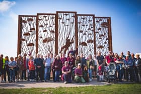 Families of Melton's wartime paratroopers pictured last month at the Arnhem sculpture on Ginkel Heath last month where 156 Battalion dropped