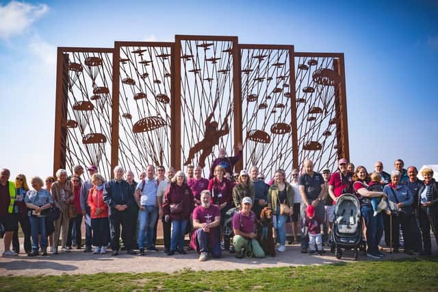 Families of Melton's wartime paratroopers pictured last month at the Arnhem sculpture on Ginkel Heath last month where 156 Battalion dropped