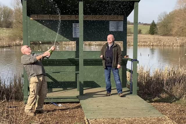 Paul Stammers and Steve Murphy toast the opening of the new bird hide at Melton Country Park