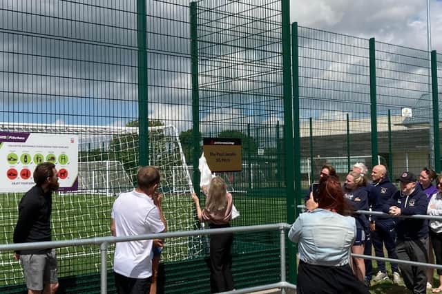 The sign is unveiled at the new 3G pitch in honour of long-serving teacher Paul Jacobs