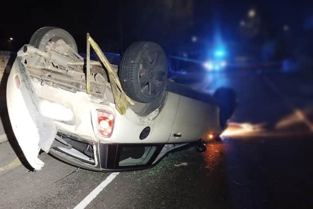 The overturned car in Welby Lane, Melton Mowbray, after it had previously been seen being driven at speed