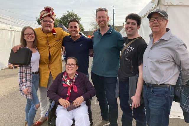 Visitors from America with local family members meet Melton's own Samosa Wallah at Melton's East Midlands Food Festival