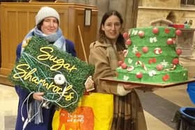 Naomi and Dionne Yeandle, owners of Sugar Shamrocks, pictured carrying part of their festival-winning Grinch tree at the Melton Christmas Tree Festival