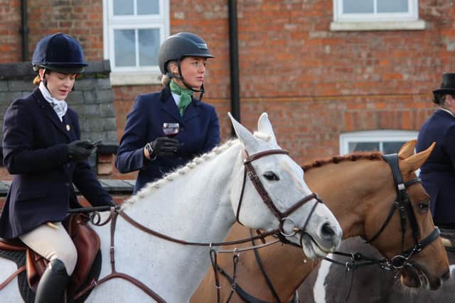 Riders take refreshments at the Melton meet