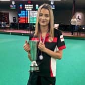 Izzy Pymm shows off the BIIBC Women's U25 International Championship trophy.