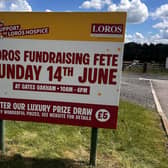 A sign advertising the Gates Garden Centre fundraising entertainment day for LOROS hospice