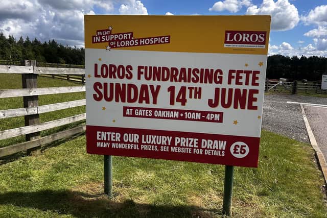 A sign advertising the Gates Garden Centre fundraising entertainment day for LOROS hospice