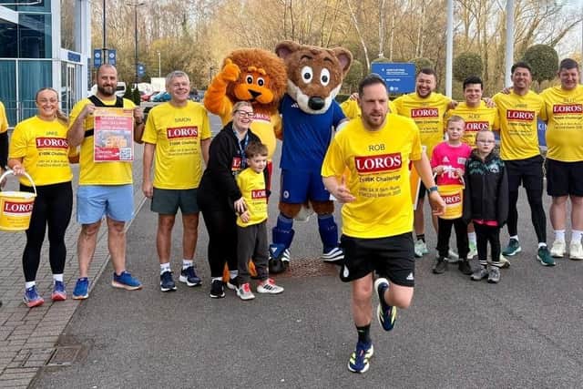 Rob Owen starts one of his fundraising runs around the King Power Stadium cheered on by supporters and mascots
