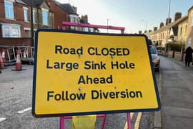 A sign warning of the closure of Thorpe Road
