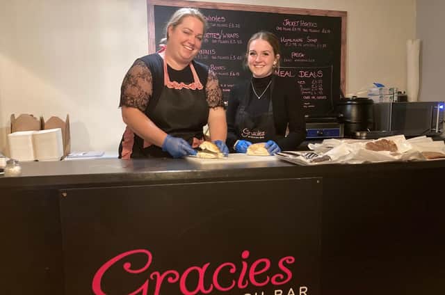 Tracy Grant (left) and Abbie Jeavons serve at the new Gracies location, in a back room at Miss B's Tearooms