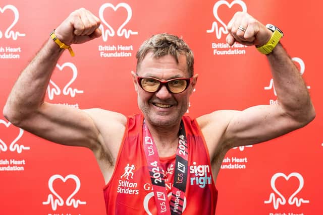 John Houghton celebrates completing Sunday's TCS London Marathon in aid of the British Heart Foundation