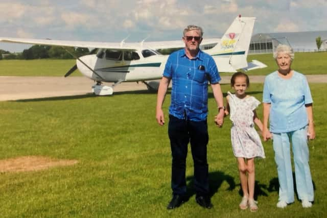 Kathleen Bishop with family members as she flew in a plane on her 95th birthday