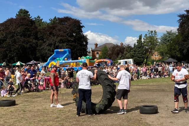 Organiser and competitor Lee Freer (right) prepares to take part in the tyre flip race at Melton's first Power in the Park event