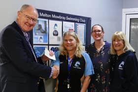 W.Bro. David Alcraft (charity steward for St Mary's Freemasons' Lodge No 7164) presents a cheque for £500 to Melton Swimming Club's Tracy McGhie (head coach), Emma Redwood (chair) and Liz Rawson (president)