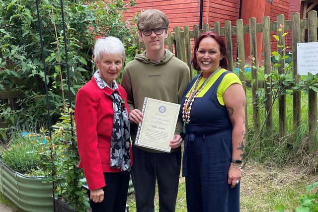 Alfie Grant with his certificate and Maggie Wilson (left) of Rotary in Melton and Lucie Larke, centre manager at The Melton Learning Hub