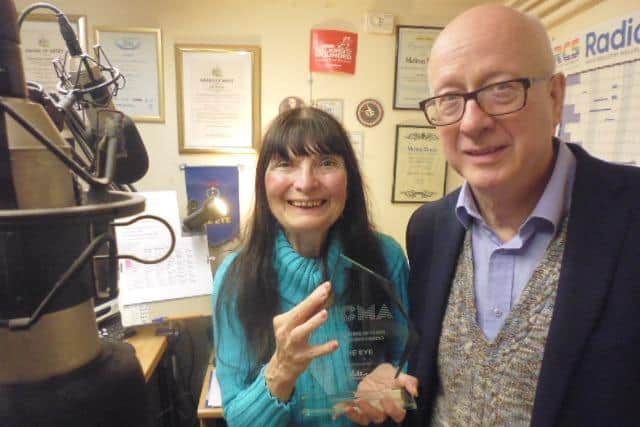Richard Hilton presenting the CMA trophy to Christine Slomkowska to mark 103 The Eye's 20-year anniversary