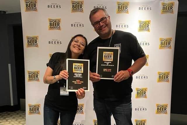 Lara Lopes and Colin Paige show off the World Beer Awards won by Round Corner Brewing, of Melton