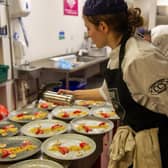 Student chefs at Radmoor Restaurant prepare meals