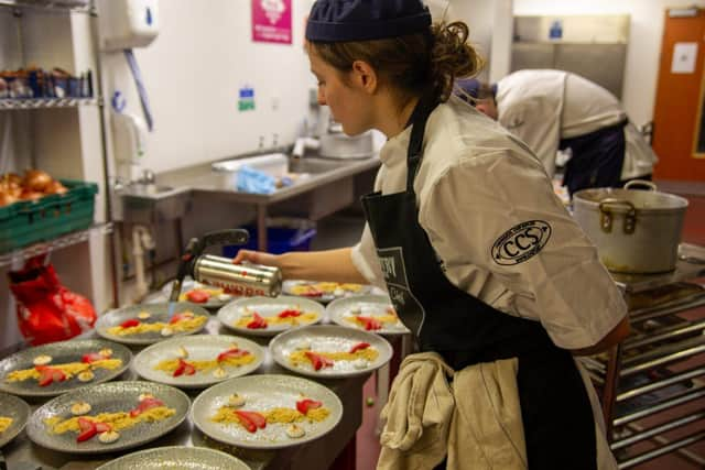 Student chefs at Radmoor Restaurant prepare meals