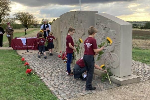 Somerby School pupils lay flowers at paratroopers war memorial