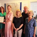 High Sheriff of Leicestershire, Henrietta Chubb, presents a special award to CEO Amanda Heath and her MADMAC team